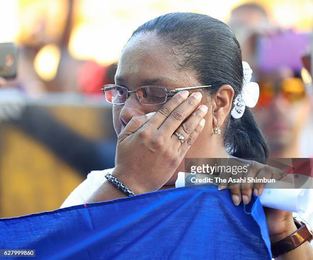 An elder woman sheds tears during a memorial event for former Cuban President Fidel Castro December 3, 2016 in Santiago de Cuba, Cuba. Castro died on...