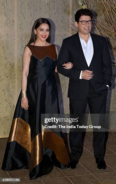 Madhuri Dixit Nene along with her husband Sriram Nene during the birthday celebrations of fashion designer Manish Malhotra in Mumbai.