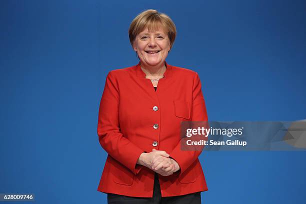 German Chancellor and Chairwoman of the German Christian Democrats Angela Merkel smiles to applauding delegates after she gave her central speech at...