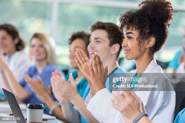 young doctors attend professional seminar - applauding nurses stock pictures, royalty-free photos & images