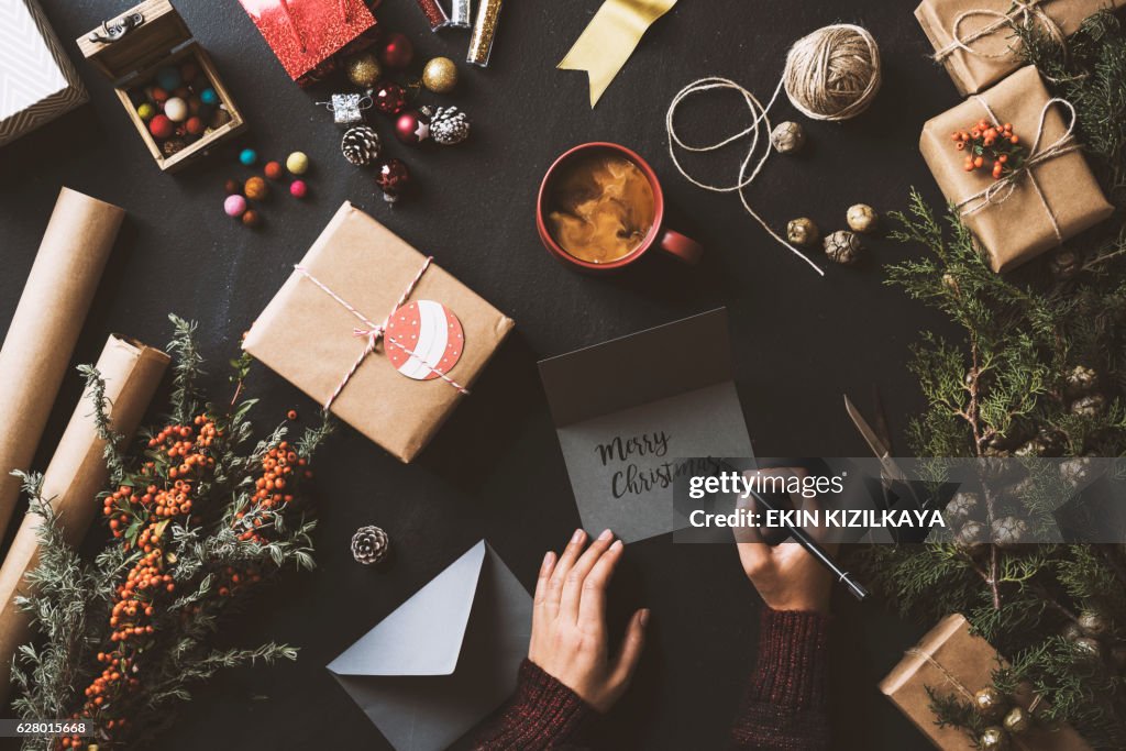 Writing Christmas cards, table top flat lay