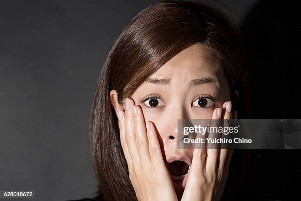 surprised woman with head in hands - sorry i missed you stock pictures, royalty-free photos & images