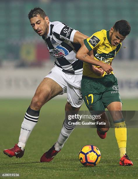 Pacos Ferreira's forward Gleison from Brazil with Boavista FC's defender Lucas in action during the Primeira Liga match between Pacos de Ferreira and...