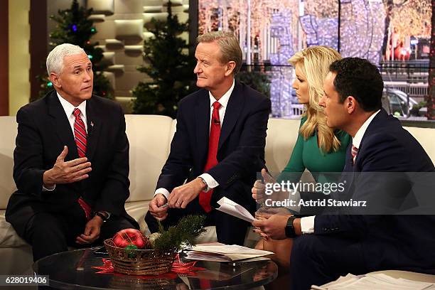 Vice President-Elect Mike Pence talks with "Fox & Friends" hosts, Steve Doocy, Ainsley Earhardt and Brian Kilmeade at Fox News Studios on December 6,...