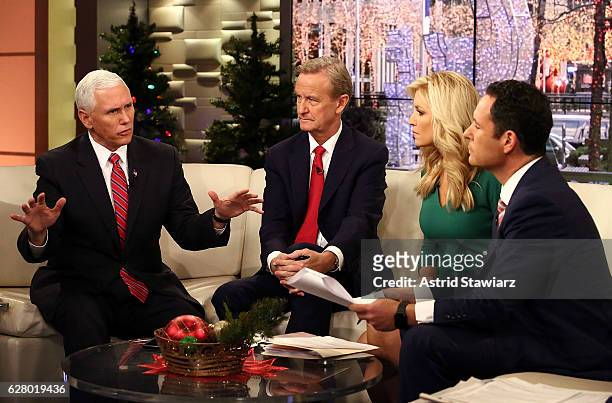 Vice President-Elect Mike Pence talks with "Fox & Friends" hosts, Steve Doocy, Ainsley Earhardt and Brian Kilmeade at Fox News Studios on December 6,...