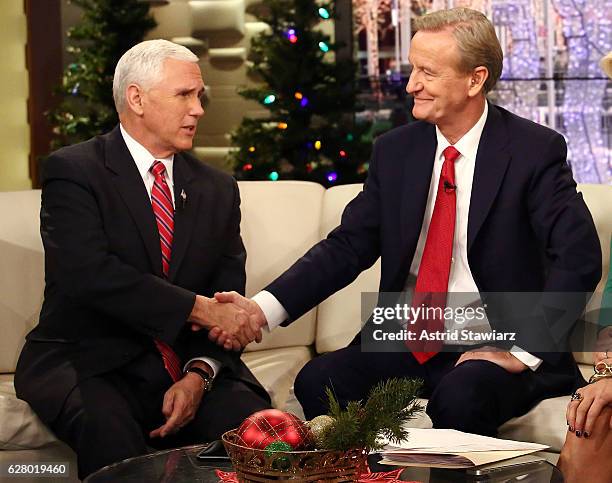 Vice President-Elect Mike Pence talks with "Fox & Friends" host Steve Doocy Fox News Studios on December 6, 2016 in New York City.