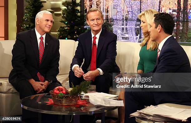 Vice President-Elect Mike Pence talks with "Fox & Friends" hosts, Steve Doocy, Ainsley Earhardt and Brian Kilmeade at Fox News Studios on December 6,...
