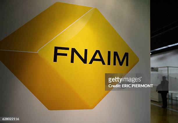 Picture shows the logo of the federation of real estate agents FNAIM at the FNAIM congress in Paris on December 6, 2016. / AFP PHOTO / ERIC PIERMONT