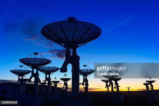 observatory antenna in the sunset - telefoonhoorn stockfoto's en -beelden