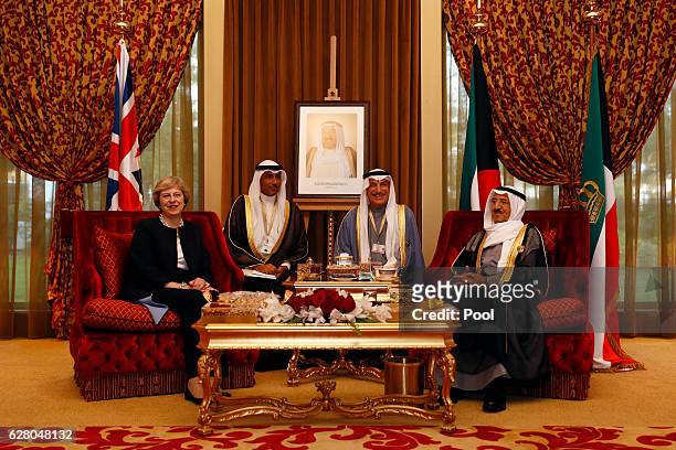 British Prime Minister Theresa May meets Kuwait's Emir Sheikh Sabah Al-Ahmed Al-Jaber Al-Sabah at the Kuwait villa on December 6, 2016 in Manama,...