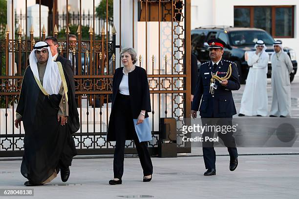 British Prime Minister Theresa May arrives at the Kuwait villa before meeting Kuwait's Emir Sheikh Sabah Al-Ahmed Al-Jaber Al-Sabah on December 6,...