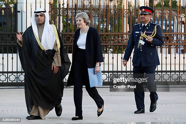 British Prime Minister Theresa May arrives at the Kuwait villa before meeting Kuwait's Emir Sheikh Sabah Al-Ahmed Al-Jaber Al-Sabah on December 6,...