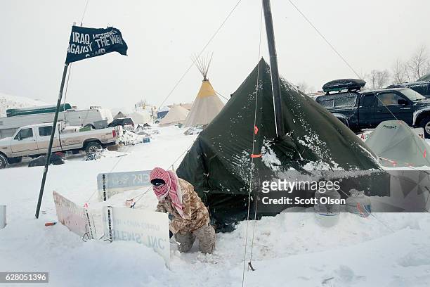 Winds whip across Oceti Sakowin Camp as blizzard conditions grip the area around the Standing Rock Sioux Reservation on December 6, 2016 outside...