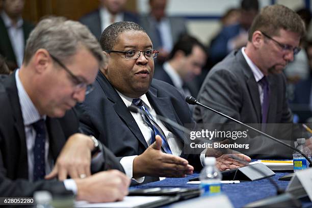 David Strickland, spokesperson for the Self-driving Coalition for Safer Streets, center, speaks as Chris Spear, president and chief executive officer...