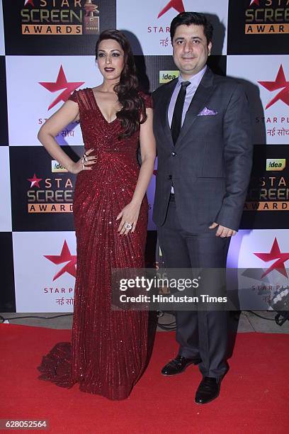 Bollywood actor Sonali Bendre with husband Goldie Behl during the 23rd Annual Star Screen Awards 2016 on December 4, 2016 in Mumbai, India.
