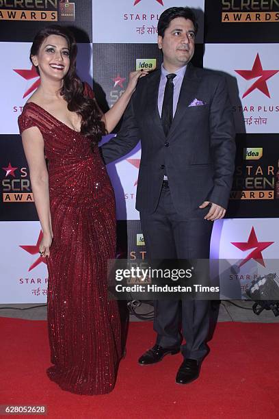 Bollywood actor Sonali Bendre with husband Goldie Behl during the 23rd Annual Star Screen Awards 2016 on December 4, 2016 in Mumbai, India.