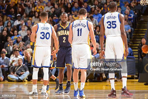 Stephen Curry, Klay Thompson and Kevin Durant of the Golden State Warriors walk up the court during the game against the Indiana Pacers on December...
