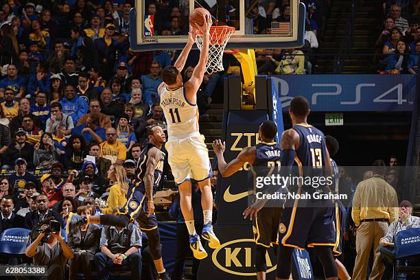 Klay Thompson of the Golden State Warriors dunks the ball against the Indiana Pacers on December 5, 2016 at ORACLE Arena in Oakland, California. NOTE...