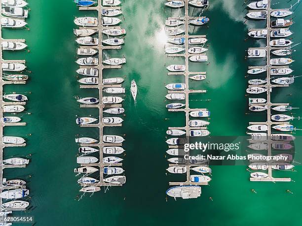 boat quay at gulf harbour marina, auckland new zealand. - new zealand boats auckland stock pictures, royalty-free photos & images