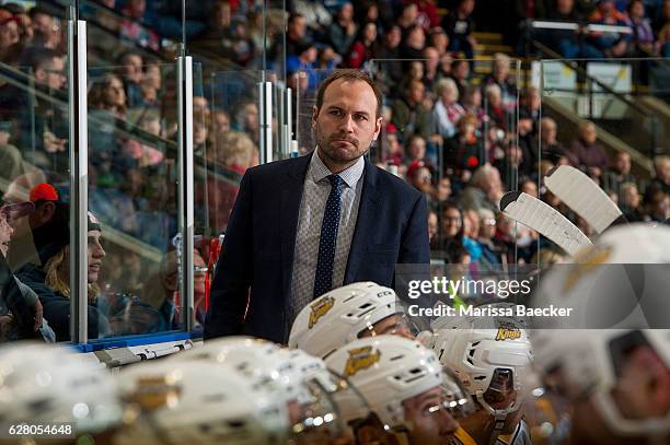 Aaron Rome, assistant coach of the Brandon Wheat Kings stands on the bench against the Kelowna Rockets on December 3, 2016 at Prospera Place in...