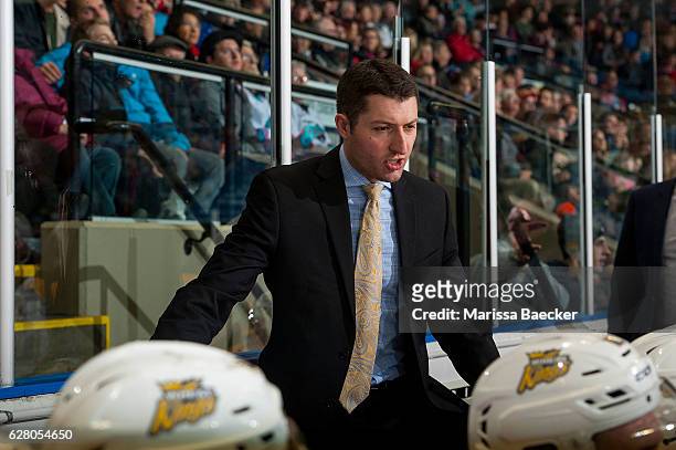 David Anning, head coach of the Brandon Wheat Kings stands on the bench against the Kelowna Rockets on December 3, 2016 at Prospera Place in Kelowna,...