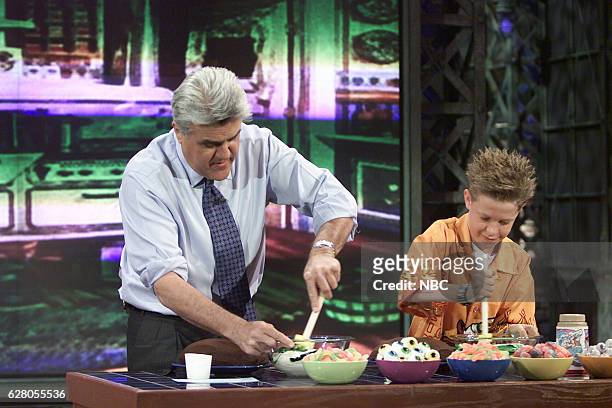 Episode 2698 -- Pictured: Host Jay Leno and baking contest winner Tyler Modjeski during a cooking segment on April 27, 2004 --