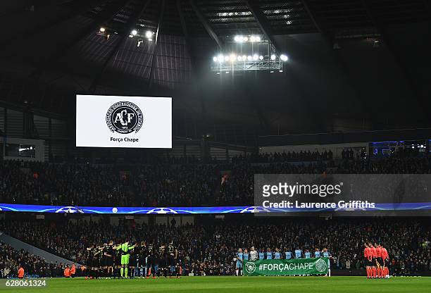 Fans, players and officials observe a minutes silence for the victims of the plane crash involving the Brazilian club Chapecoense prior to kick off...