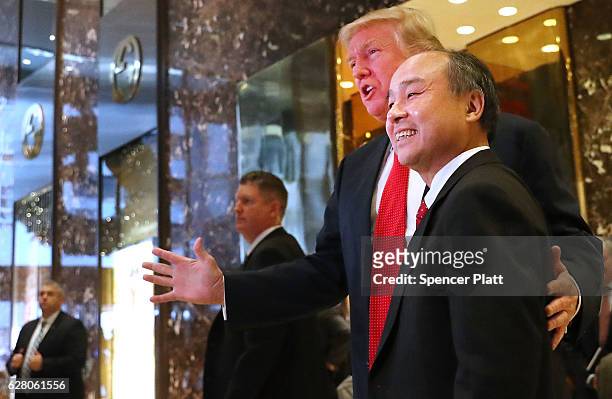 President-elect Donald Trump pauses with Masayoshi Son, the chief executive of SoftBank, at Trump Tower on December 6, 2016 in New York City. Trump...