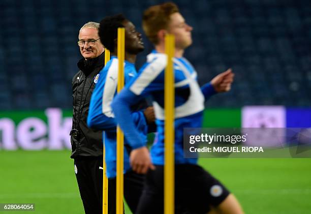 Leicester City's Italian coach Claudio Ranieri looks at his players during a training session at the Dragao stadium in Porto, on December 6 on the...