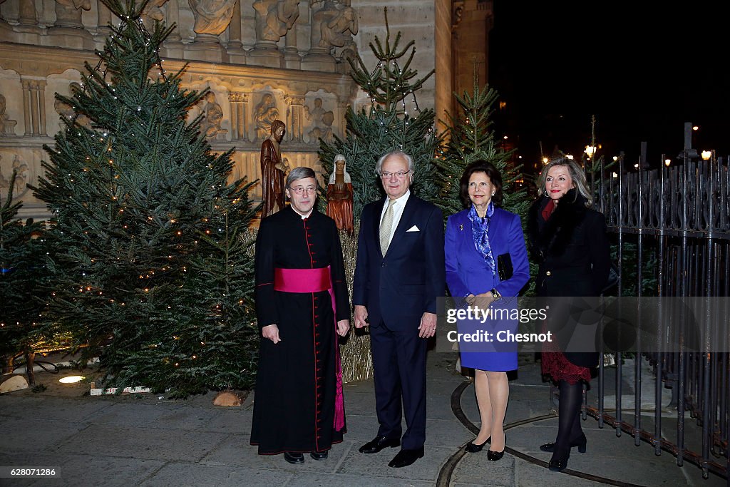 Queen Silvia of Sweden and King Carl XVI Gustaf of Sweden Attend The Sainte Lucie Concert At Notre Dame In Paris