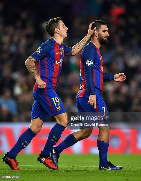 Arda Turan of Barcelona celebrates with Lucas Digne as he scores their second goal during the UEFA Champions League Group C match between FC...