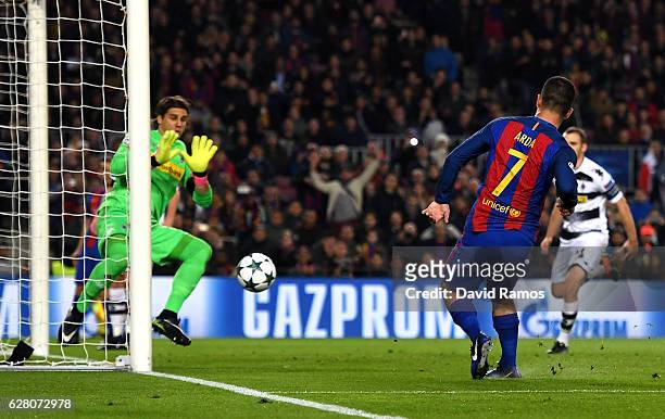 Arda Turan of Barcelona scores his sides fourth goal during the UEFA Champions League Group C match between FC Barcelona and VfL Borussia...