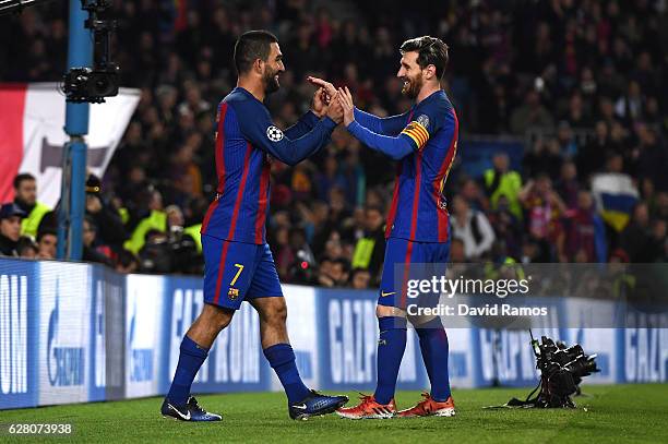 Arda Turan of Barcelona celebrates scoring his sides fourth goal with Lionel Messi of Barcelona during the UEFA Champions League Group C match...