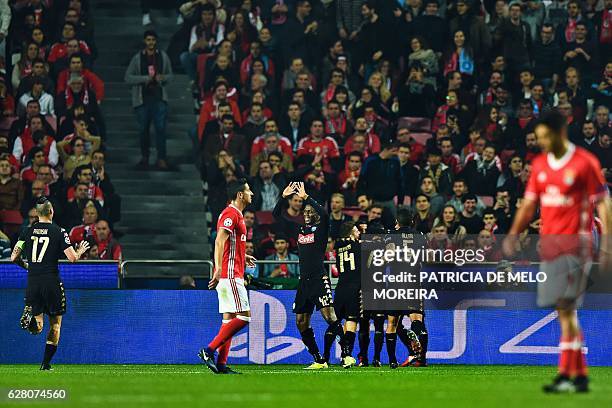 Napoli's players celebrate after Napoli's Spanish forward Jose Callejon scored during the UEFA Champions League Group B football match SL Benfica vs...