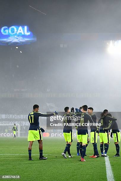 Arsenal's players celebrates after scoring their fourth goal during the UEFA Champions league Group A football match between FC Basel 1893 and...