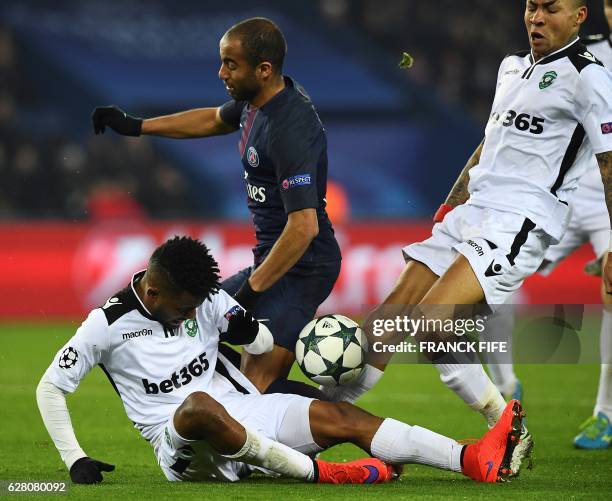 Paris Saint-Germain's Brazilian midfielder Lucas Moura vies with Ludogorets' Brazilian defender Cicinho and Ludogorets' Madagascan midfielder Anicet...