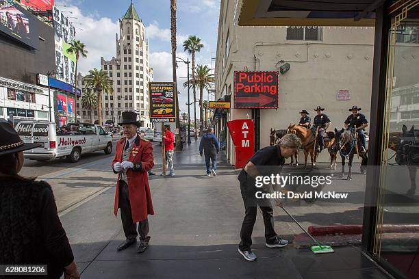 Los Angeles Police Department Mounted Platoon officers stand guard on Hollywood Boulevard as police and deputies step up security near the...