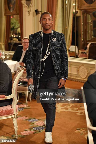 Pharell Williams walks the runway during "Chanel Collection des Metiers d'Art 2016/17 : Paris Cosmopolite" show on December 6, 2016 in Paris, France.