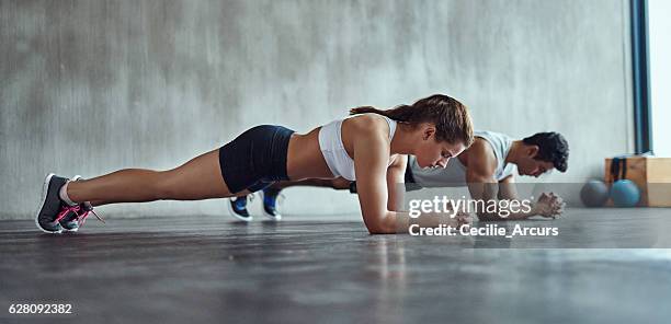 it's great for the abs - dynamic plank exercise stock pictures, royalty-free photos & images
