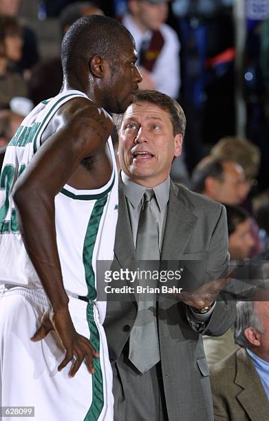 Head coach Tom Izzo of Michigan State talks with his player Jason Richardson during the semifinal of the Men's NCAA Basketball Final Four tournament...