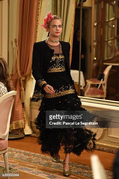 Cara Delevingne walks the runway during "Chanel Collection des Metiers d'Art 2016/17 : Paris Cosmopolite" show on December 6, 2016 in Paris, France.