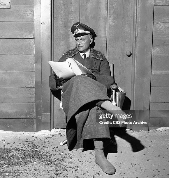 Hogan's Heroes episode Happy Birthday, Adolf. Pictured is a behind the scenes shot, Werner Klemperer relaxing, with boots off. Image dated July 14,...