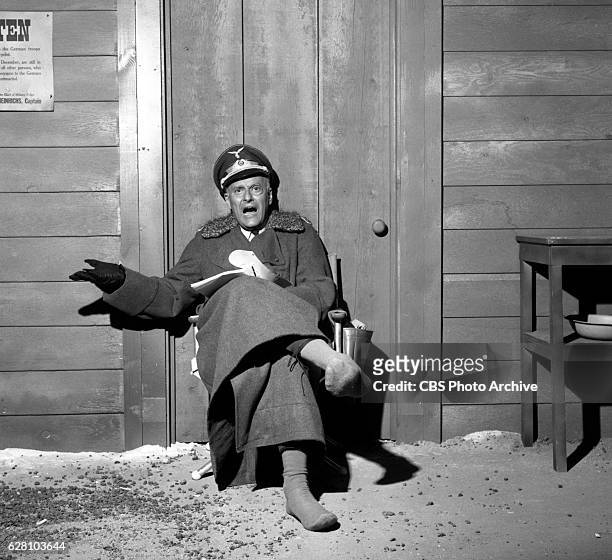 Hogan's Heroes episode Happy Birthday, Adolf. Pictured is a behind the scenes shot, Werner Klemperer relaxing, with boots off. Image dated July 14,...