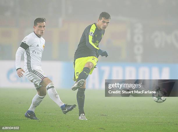 Granit Xhaka of Arsenal takes on Taulant Xhaka of Basel during the UEFA Champions League match between FC Basel and Arsenal at St. Jakob-Park on...