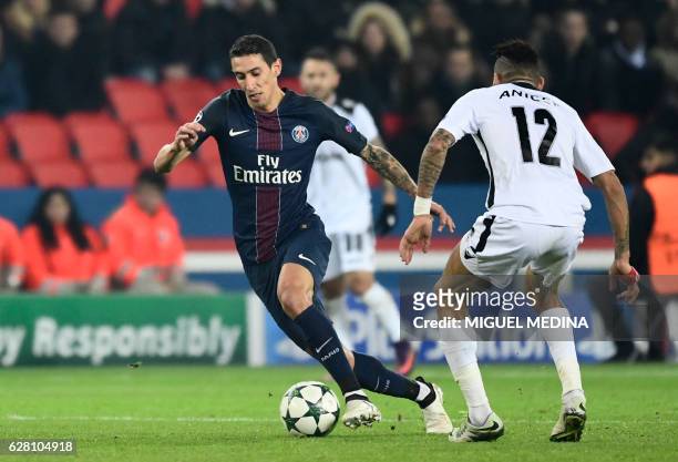 Paris Saint-Germain's Argentinian forward Angel Di Maria vies for the ball with Ludogorets' Madagascan midfielder Anicet Abel during the UEFA...