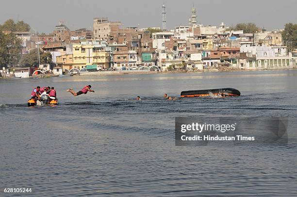 Team demonstrating life saving skills in water during 70th foundation day of MP Home Guards and Civil Defense on December 6, 2016 in Bhopal, India.