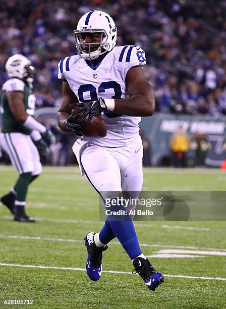 Dwayne Allen of the Indianapolis Colts scores a touchdown against the New York Jets during their game at MetLife Stadium on December 5, 2016 in East...