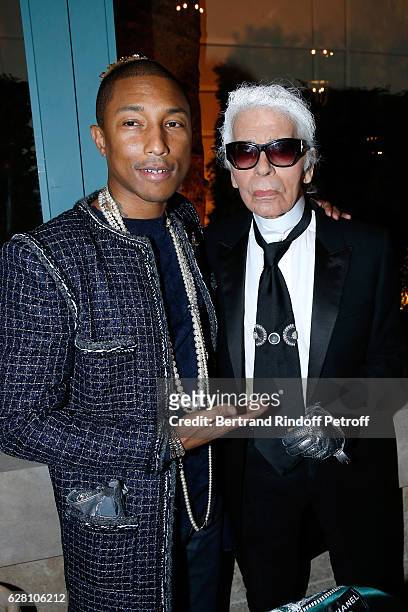Pharrell Williams and stylist Karl Lagerfeld attend the "Chanel Collection des Metiers d'Art 2016/17 : Paris Cosmopolite" : Show at Hotel Ritz on...