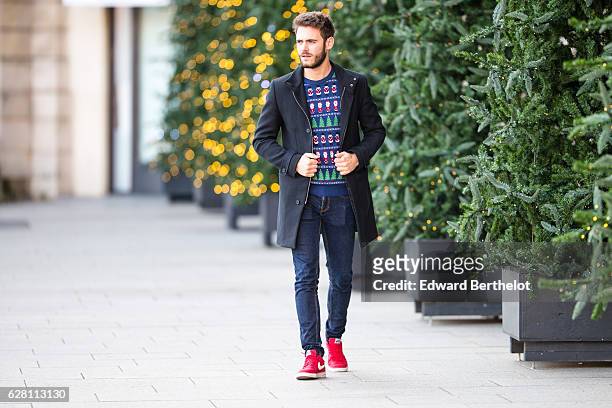 Kevin Ragonneau, fashion and life style blogger @kevinragonneau, is wearing a Marks & Spencer Christmas themed pull over, Nike red shoes, a Carnet de...