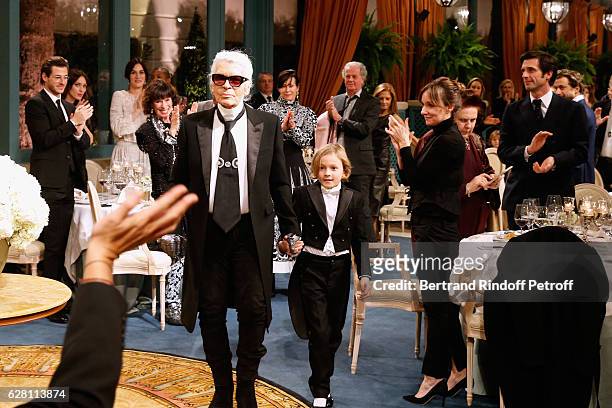Gaspard Ulliel, Gaelle Pietri and Geraldine Chaplin applause Stylist Karl Lagerfeld and his Godson Hudson Kroenig, who acknowledge the applause of...